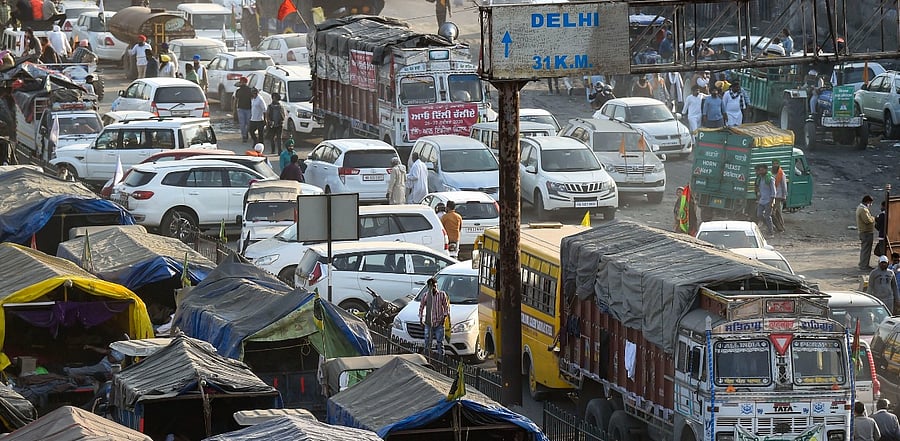 ehicles of farmers parked on the highway at the Singhu border during 'Delhi Chalo' protest against the new farm laws, in New Delhi. Credit: PTI Photo