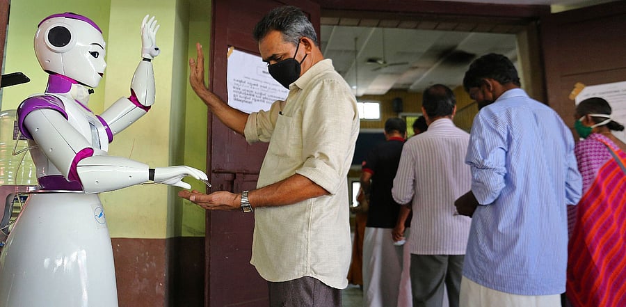 A robot dispenses sanitizer as a preventive measure against Covid-19. Credit: AFP Photo