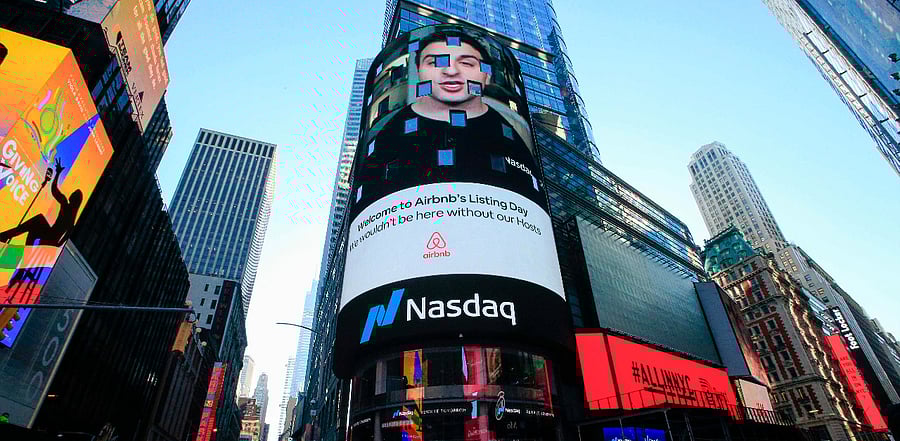 The Airbnb logo is displayed on the Nasdaq digital billboard in Times Square in New York. Credit: AFP Photo