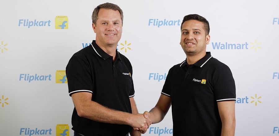  Walmart Chief Executive Officer Dough McMillon (L). Credit: Patrick Joseph