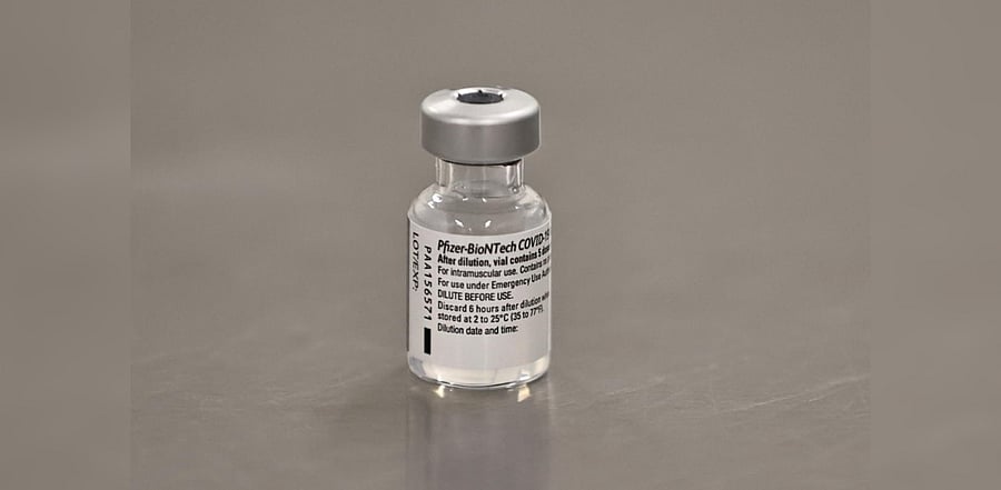A vial of the Pfizer/BioNTech COVID-19 vaccine is seen ahead of being administered at the Royal Victoria Hospital, on the first day of the largest immunisation programme in the British history, in Belfast, Northern Ireland December 8, 2020. Credit: Reuters File Photo