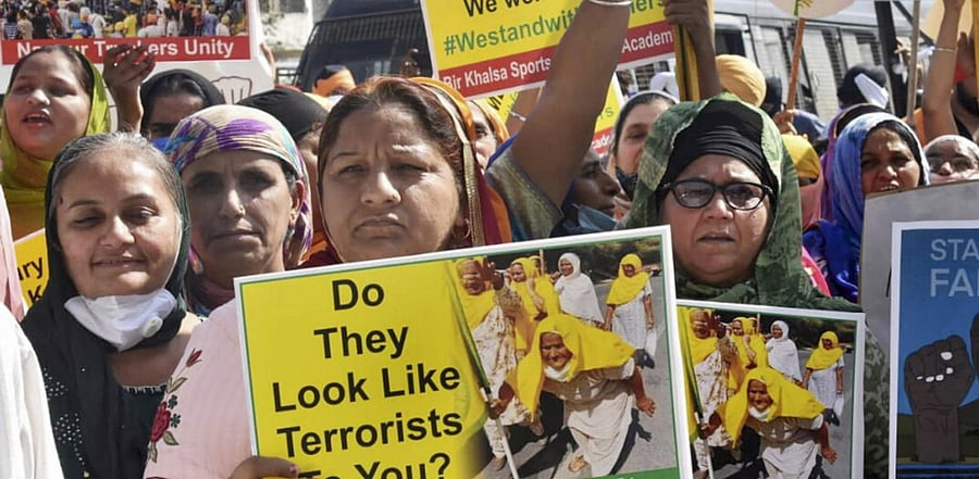 Many women are joining the protesters, making the trip from village towards the national capital even if for only a few days at a time. Credit: PTI Photo