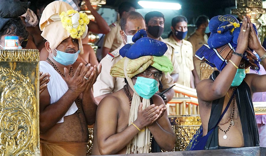 Devotees offer prayers at Lord Ayyappa temple, in Sabarimala, Pathanamthitta,Tuesday, Nov. 17, 2020. Credit: PTI Photo