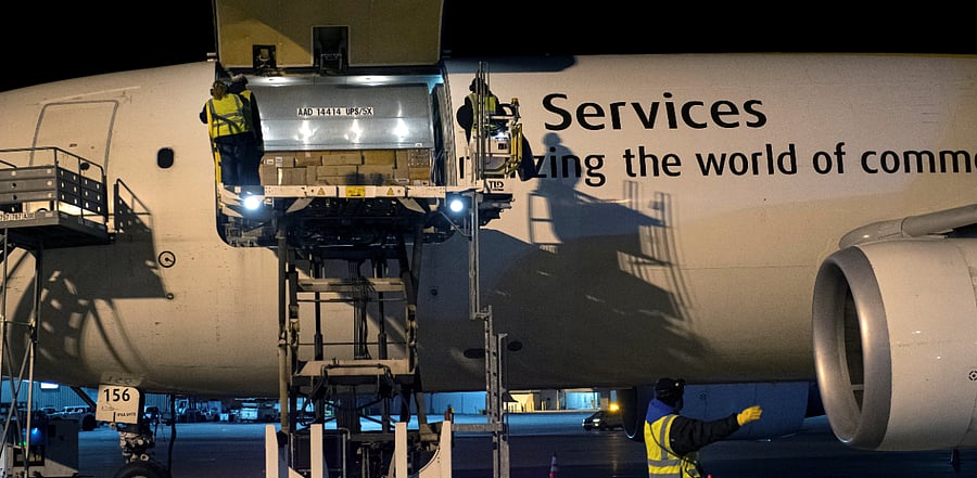 Canada's first batch of Pfizer/BioNTEch Covid-19 vaccines are unloaded from a UPS cargo plane at Montreal-Mirabel International Airport. Credit: Reuters