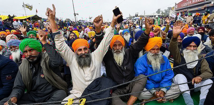 Farmers protest against the new farm laws, at Singhu border in New Delhi. Credit: PTI Photo