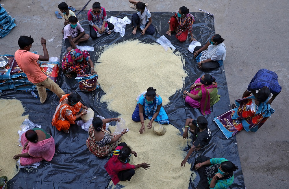 Volunteers pack rice to be distributed among poor people during a 21-day nationwide lockdown. Credit: Reuters Photo