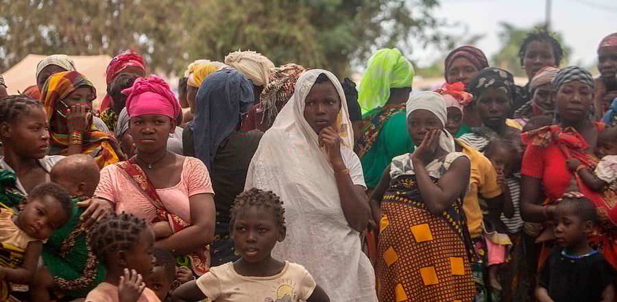 Displaced women attend a meeting on December 11, 2020 at the Centro Agr‡rio de Napala where hundreds of displaced arrived in recent months are sheltered, fleeing attacks by armed insurgents in different areas of the province of Cabo Delgado, in northern Mozambique. Credit: AFP Photo