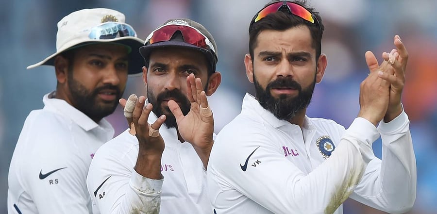 Indian team captain Virat Kohli (R), Ajinkya Rahane (C) and Rohit Sharma. Credit: AFP Photo