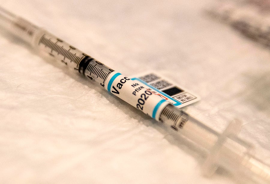 A syringe of Covid-19 vaccine is ready on a table at Ronald Reagan UCLA Medical Center in Westwood, California on December 16, 2020. Credit: AFP Photo