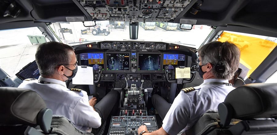Pilots are pictured in the cockpit of a Boeing 737 MAX aircraft operated by low-cost airline Gol as it sits on the tarmac before take off at Guarulhos International Airport, near Sao Paulo. Credit: AFP
