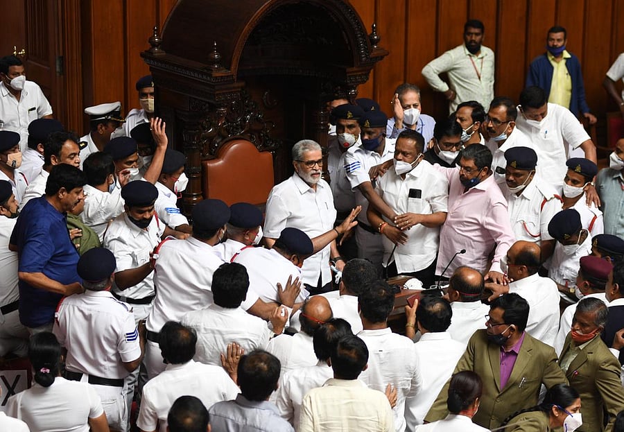 Karnataka Legislative Council Chairman K Pratapachandra Shetty adjourns the council after ruckus between BJP and Congress leaders during the Karnataka Legislative Council, Congress MLCs heckled and pushed Deputy Chairman of the Legislative Council, SL Dharme Gowda, from his seat, at Vidhana Soudha, in Bengaluru on Tuesday. Credit: DH Photo/ B H Shivakumar