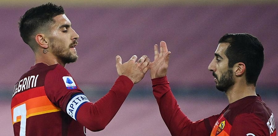 Roma's Italian midfielder Lorenzo Pellegrini celebrates with Roma's Armenian midfielder Henrikh Mkhitaryan (R) after scoring during the Italian Serie A match between AS Roma and Torino at the Olympic stadium in Rome. Credit: AFP