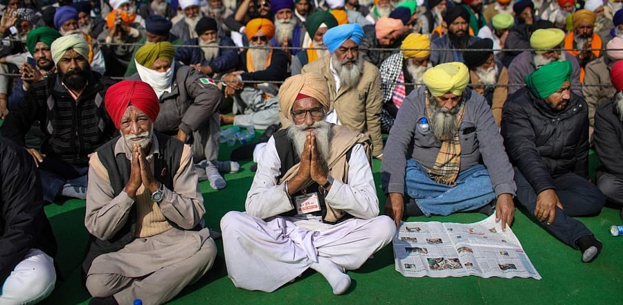 Farmers during a protest against the Center's new farm laws at Singhu Border in New Delhi. Credit: PTI Photo