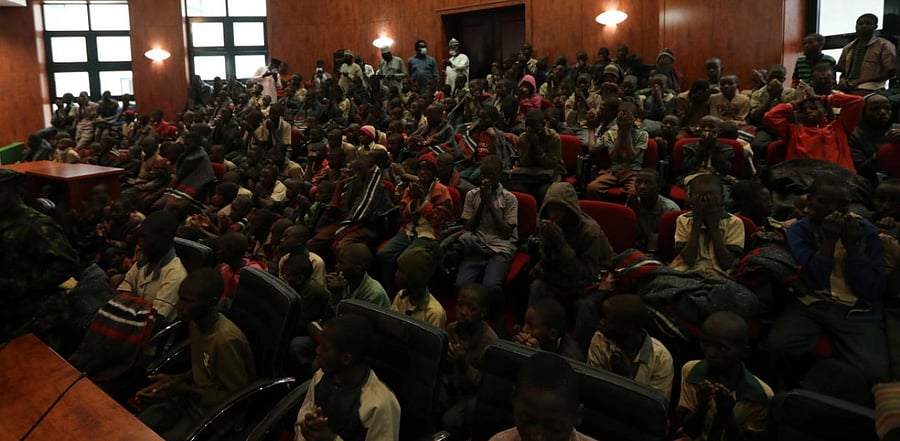 Rescued Nigerian school boys sit together at the Government house in Katsina. Credit: Reuters.