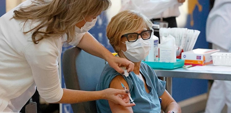 A medical worker gets vaccinated against Covid-19 coronavirus at Sourasky Medical Center (Ichilov) in the Israeli coastal city of Tel Aviv. Credit: AFP.