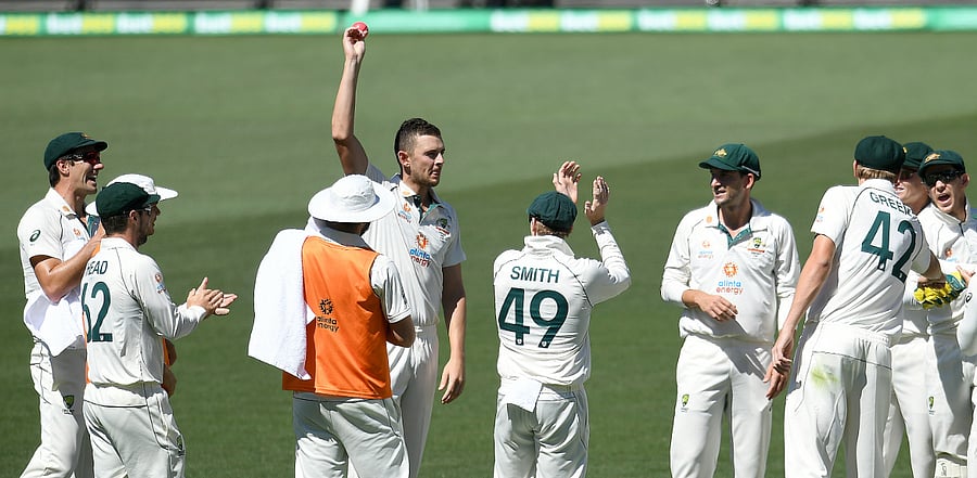 Australia's Josh Hazlewood shows the ball after taking his 5th wicket on Day 3 of the first Test in Adelaide. Credit: Reuters Photo