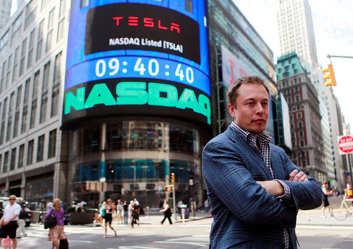 Tesla shares fall from record high in S&P 500 debut