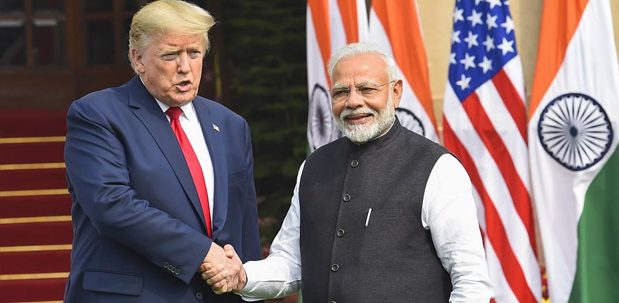 Prime Minister Narendra Modi shakes hands with US President Donald Trump. Credit: PTI File Photo