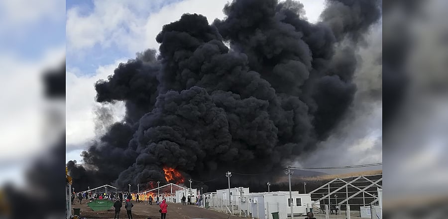 Smoke rises from a fire at migrant camp Lipa, Wednesday, Dec 23, 2020, near Bihac in western Bosnia. Credit: AFP Photo