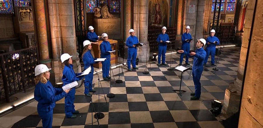 Musicians of the Maitrise Notre-Dame de Paris performing inside the Notre-Dame de Paris Cathedral in Paris on Christmas Eve. Credit: AFP Photo