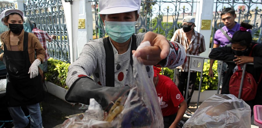 Anti government protesters sell shrimps in front of government house as people now fear to eat shrimps due to the Covid-19 outbreak in Bangkok, Thailand. Credit: Reuters
