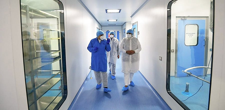 Prime Minister Narendra Modi being briefed during a visit to the Bharat Biotech facility to review the development of indigenous Covid-19 vaccine candidate Covaxin, on the outskirts of Hyderabad on November 28, 2020. Credit: PTI Photo