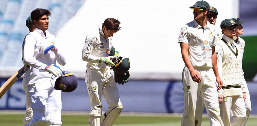 Australia's captain Tim Paine (C) leads his team off the field after their loss to India in the second cricket Test match played at the MCG in Melbourne. Credit: AFP