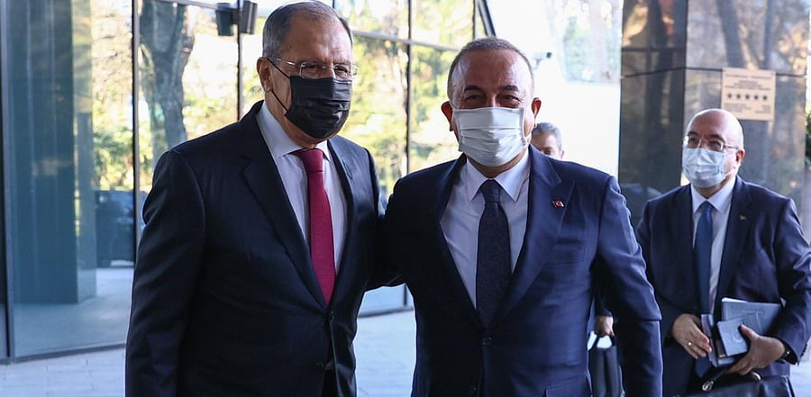 Russian Foreign Minister Sergei Lavrov (L) welcoming his Turkish counterpart Mevlut Cavusoglu as they pose for pictures ahead of their meeting in Sochi. Credit: AFP Photo