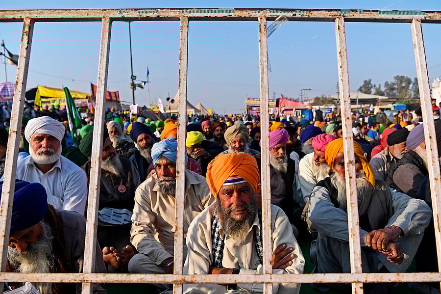 Farmers take part in a demonstration against the central government's recent agricultural reforms while blocking a highway at the Delhi-Haryana state border in Singhu on December 29, 2020. Credit: AFP Photo