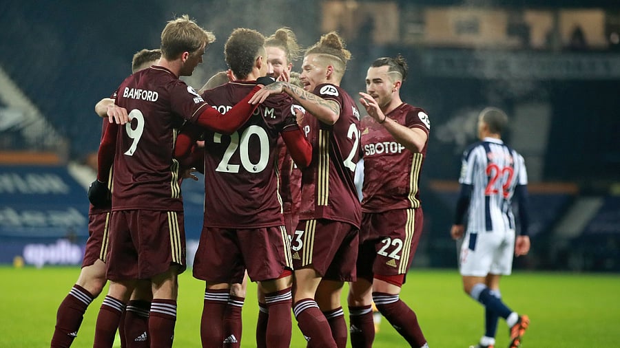 Leeds United's Brazilian-born Spanish striker Rodrigo (C) celebrates with teammates after scoring their fourth goal during the English Premier League football match between West Bromwich Albion and Leeds United. Credit: AFP Photo