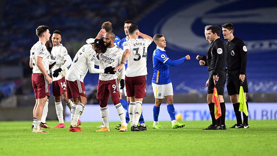 Arsenal's French striker Alexandre Lacazette celebrates after the English Premier League football match between Brighton and Hove Albion and Arsenal. Credit: AFP Photo