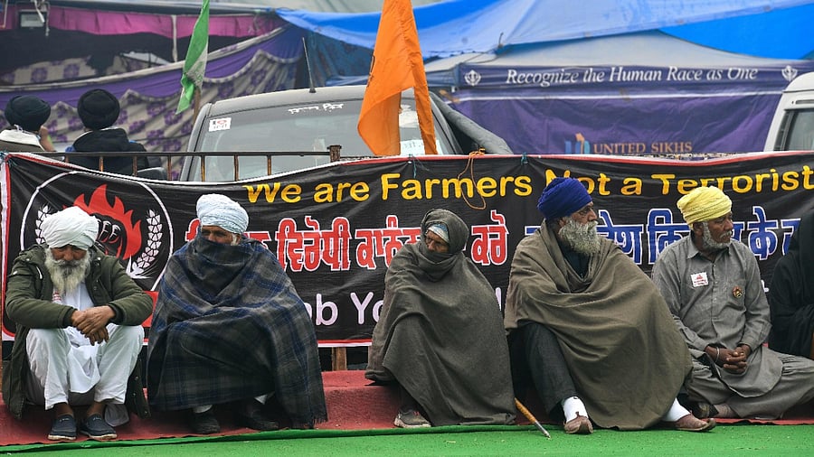 Farmers take part in a protest against the central government's recent agricultural reforms while blocking a highway at the Delhi-Haryana state border in Singhu. Credit: AFP Photo