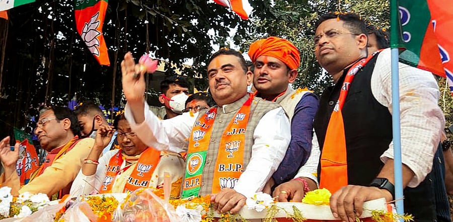 BJP leader Suvendu Adhikari during a roadshow from Mecheda Bypass to Central Bus Stand in Kanthi, East Midnapore district. Credit: PTI.
