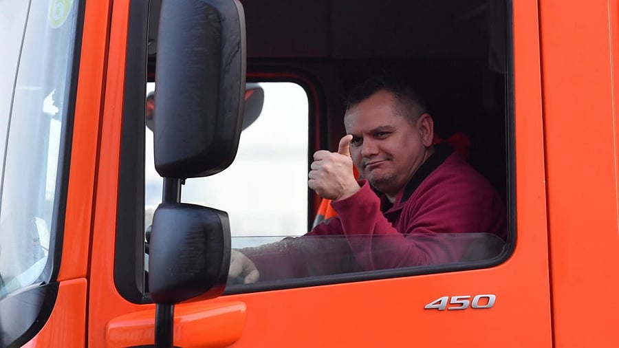 A lorry driver gestures as he enters the Port of Dover on the first day after the end of the Brexit transition period, in Dover. Credit: Reuters.
