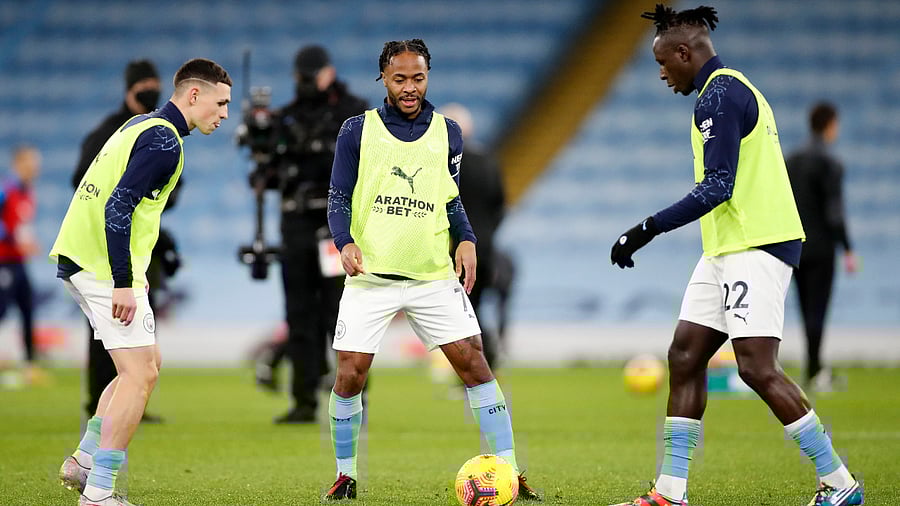 Manchester City's Phil Foden, Raheem Sterling and Benjamin Mendy during the warm up. Credit: Reuters Photo