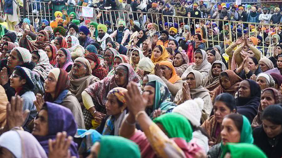 Farmers during their protest against the new farm laws, at Singhu border. Credit: PTI Photo