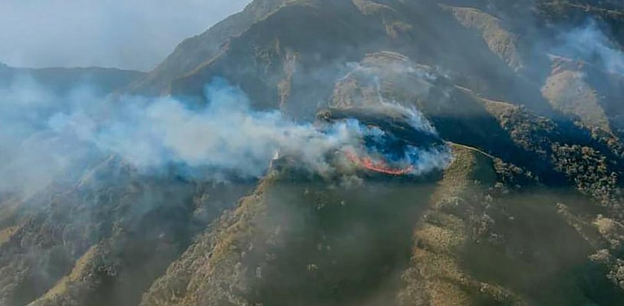 Smoke rises during a forest fire that broke out in the Dzukou Valley of Kohima district. Credit: PTI Photo