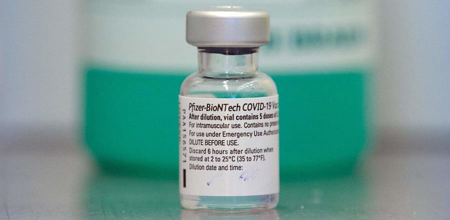 A vial with the Pfizer-BioNTech COVID-19 vaccine is pictured at a vaccination centre installed. Credit: AFP Photo
