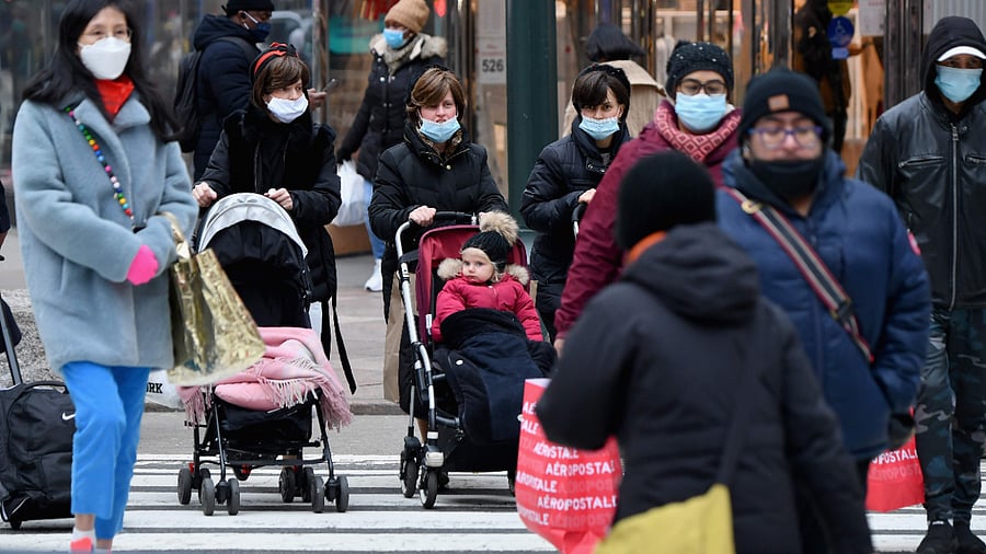 People walk through a busy shopping area amid the coronavirus pandemic. Credit: AFP Photo