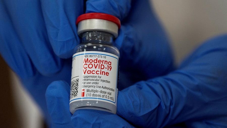 An employee shows the Moderna Covid-19 vaccine at Northwell Health's Long Island Jewish Valley Stream hospital in New York, US. Credit: Reuters File Photo