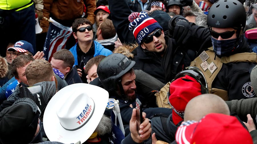 A police officer is dragged in a crowd of pro-Trump protesters during a clash at a rally to contest the certification of the 2020 US presidential election results by the US Congress, at the US Capitol Building in Washington, US. Credit: Reuters Photo