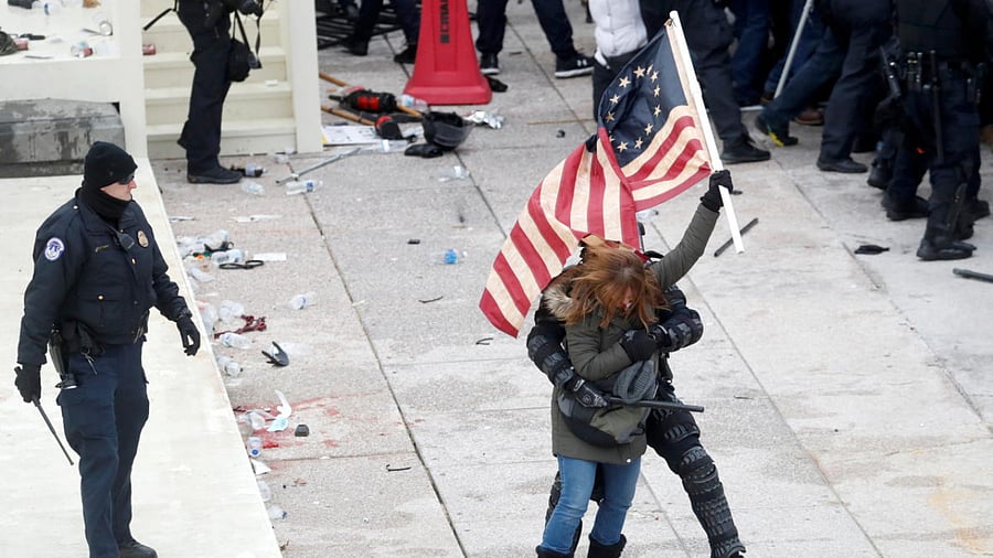 A police officer detains a pro-Trump protesters during clashes at a rally to contest the certification of the 2020 U.S. presidential election results by the U.S. Congress, at the US Capitol Building in Washington, US Credit: Reuters Photo