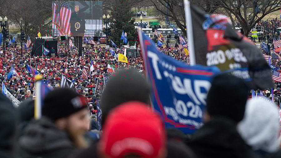 Supporters of US President Donald Trump gather to hear him speak during a rally in his support. Credit: AFP Photo