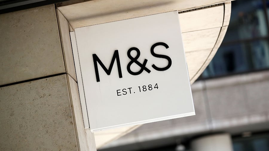 In this file photo taken on July 20, 2020 A logo is pictured on a sign outside an M&S (Marks and Spencer) store in central London. Credit: AFP Photo