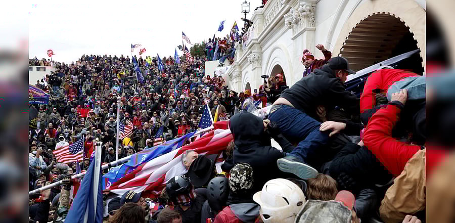 Pro-Trump protesters storm into the US Capitol during clashes with police, during a rally to contest the certification of the 2020 US presidential election results by the US Congress, in Washington. Credit: Reuters Photo