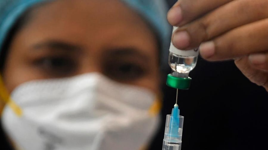 A health worker takes part in a dry run or mock drill for the Covid-19 coronavirus vaccine delivery held at SSKM hospital in Kolkata on January 8, 2021. Credit: AFP Photo