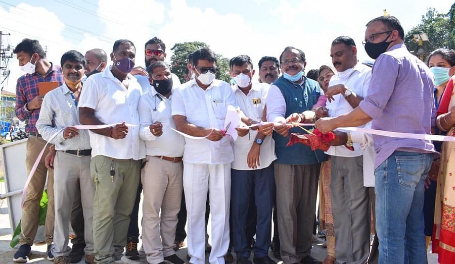 MLA Appachu Ranjan inaugurates the road leading to SAI hockey ground in Madikeri.