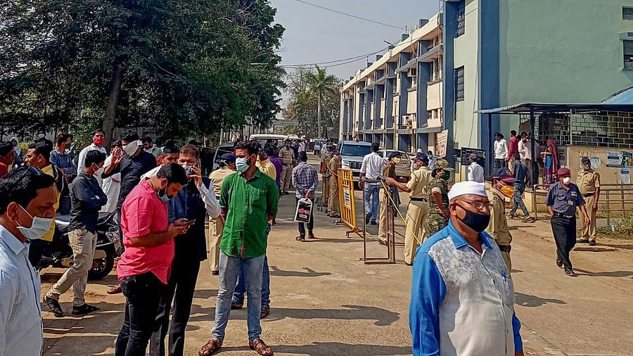 Police personnel guard outside the Bhandara district General Hospital after a fire broke out in its new born babies care unit in the wee hours, in Bhandara district of Maharashtra. Credit: PTI Photo