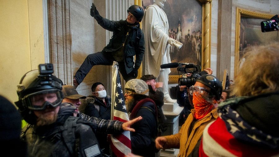 Pro-Trump protesters storm the Capitol Building on January 6. Credit: Reuters Photo/Ahmed Gaber