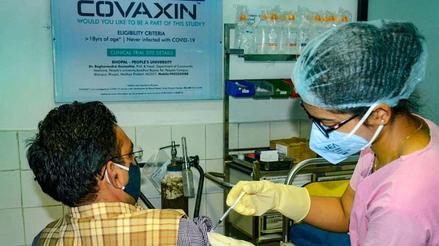 A medic administers Covaxin, developed by Bharat Biotech in collaboration with the Indian Council of Medical Research (ICMR), during the Phase- 3 trials at the People's Medical College in Bhopal, Monday, Dec. 7, 2020. Credit: PTI Photo